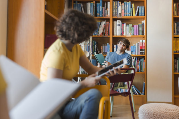 teenagers looking each other library 23 2147860570